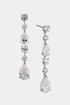 These classic, timeless earrings feature a knife edge connection technique and mixed cut pear and round stones for maximum sparkle. Upgrade any outfit with these elegant, linear earrings. Elegant Long Drop Crystal Linear Earrings, Formal Long Drop Linear Earrings, Cubic Zirconia Long Drop Linear Earrings, Classic Cubic Zirconia Long Drop Linear Earrings, Silver Long Drop Linear Earrings With Sparkling Stones, Silver Long Drop Earrings With Sparkling Stones, Ring Sale, Modern Love, Diamond Drop Earrings