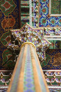 an intricately decorated building with blue and green tiles