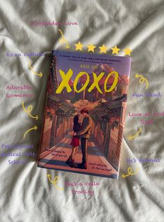 a book on a bed with the title'art of xoxo '