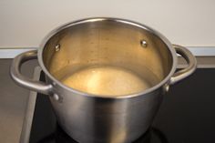 a large metal pot sitting on top of a stove