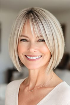 Save this pin for the best hairstyles for women over 40 with thin hairGet texture and volume with this sleek take on the classic bob for thin hairThe razored ends create bodywhile wispy bangs add a modern touch. Fine Hair Mid Length Styles, Short Blonde Bobs Fine Hair, Wispy Fringe Bangs, Bob With Fringe Bangs, Fat Face Haircuts, Fine Hair Bangs, Fuller Looking Hair, Best Hairstyles For Women, Textured Bangs