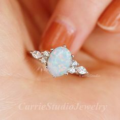 Vintage sterling silver white Opal ring, beautiful promise ring, unique birthday or anniversary gift. Materail: 925 Sterling Silver Main Stone: 6*8 mm Lab Opal Cut: Oval Side stone: CZ CS0456 ✈Free Shipping; 🎁Packaed with beautiful ring box; ★ 30 days return plicy; 🌺Custom service: 👉Stones can be different color, please contact for a custom request; 👉Can also customize with solid gold; 👉Engraving available; Home page:  https://www.etsy.com/shop/CarrieStudio Opal Engagement Ring Silver, Wedding Manifestation, Birth Stone Jewelry, White Opal Engagement Ring, Beautiful Promise Rings, Opal Ring Silver, Nails Girly, Engagement Ring Silver, Rings Opal