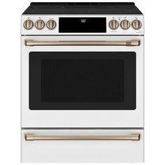 a white oven with gold trim and two burners on the front, and an oven door