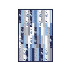 a blue and white quilted wall hanging