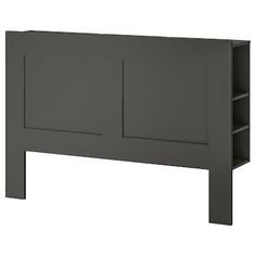 a gray headboard with two shelves on each side