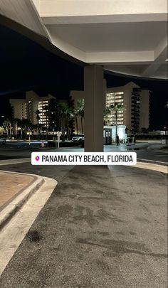 an empty parking lot at night with the words panorama city beach, florida