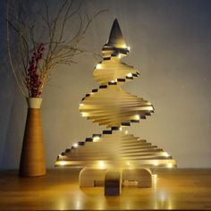 a wooden christmas tree with lights on it