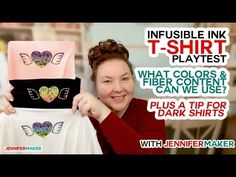 a woman holding up a t - shirt with hearts on it and the words, invisible ink