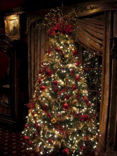 a decorated christmas tree with lights and ornaments