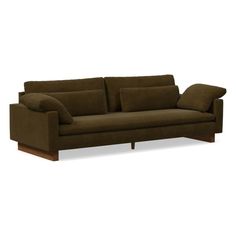 a brown couch sitting on top of a white floor