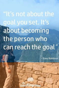 a man standing on top of a stone wall with a quote about it's not about the goal you set it's about becoming the person who can reach the goal