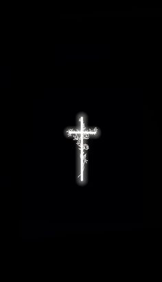 the cross is lit up in the dark with white light on it's side