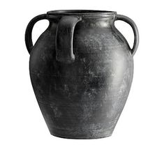 an old black vase is shown on a white background for use as a design element