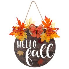 a wooden sign that says hello fall hanging from a string with leaves and bows on it