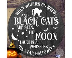 a wooden sign that says when witches go blind and black cats are seen the moon laughs & whispers its near halloween