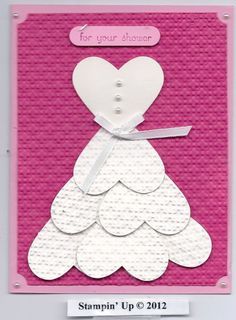 a card with a paper cut out of a woman's dress