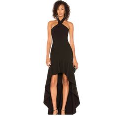 Likely Jenny Halter Ruffle Hi Low Black Dress This Gown Is Far From Simple With Its High-Low Ruffled Hem And Its Crossed Halter Straps. Designed Sharply For The Young Millennial Consumer To Reflect Modern Femininity. Features: Brand: Likely Style: Jenny Size: 0 Material: Polyester/Rayon/Spandex Color: Black Contemporary Line Fitted Body-Con Silhouette Hidden Zip Closure Asymmetric Ruffle Hem Halter Neckline W/ Button Closure Fully Lined High Low Hem Black Likely Jenny Halter Asymmetrical Gown Wi Asymmetrical Gown, Halter Gown, Gown Dress, Halter Neckline, Classic Beauty, High Low Hem, Ruffle Hem, Formal Event, Gowns Dresses