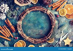 christmas wreath with oranges and spices on blue background stock photo - image 34978