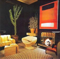 a living room filled with furniture and a fire place next to a potted plant