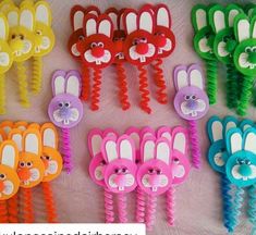 several different colored hair clips with faces and ears on top of each other, all in different colors