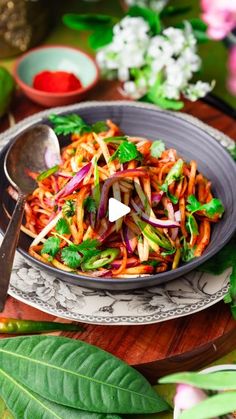 a salad with carrots, radishes and cilantro in a bowl