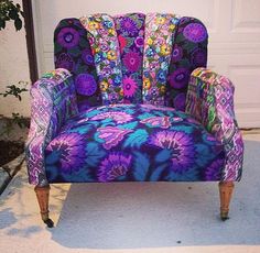 a colorful chair sitting in front of a white door