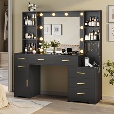 a vanity with lighted lights and drawers in a room next to a plant on the floor