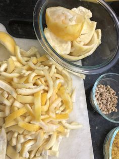 some food is being prepared in bowls on a counter top and ready to be eaten