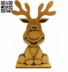 a wooden reindeer sitting on the ground with a qr code in front of it