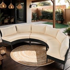 an outdoor living area with furniture and lights