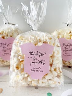 three bags filled with popcorn sitting on top of a table