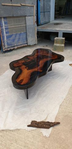 a wooden table sitting on top of a white piece of paper