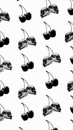 black and white photo of cherries with sunglasses on them, all in the same pattern