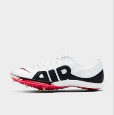 the nike air zoom golf shoe is white and black with red accents on the soles