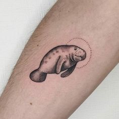 a small manatoo tattoo on the arm