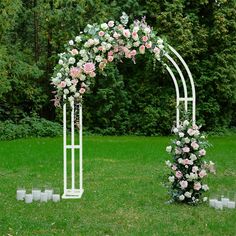 an outdoor wedding ceremony setup with flowers and candles