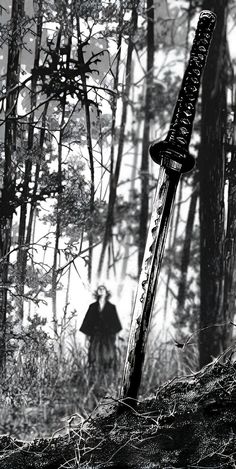 a knife stuck in the side of a tree trunk with a man standing behind it