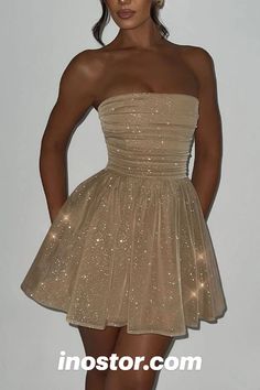 Get ready to shine and steal the spotlight in our Sequin Bow Strapless Mini Dress!  Here's why this dress is an absolute showstopper:  Glittering Sequin Design: The entire dress is adorned with dazzling sequins that catch the light and make you sparkle with every step.  Chic Strapless Style: The strapless design adds a touch of elegance and showcases your shoulders and neckline beautifully.  Versatile and Fun: Whether you're heading to a cocktail party, a night out, or a special event, this dress is your go-to choice for making a statement. Sweet Sixteen Short Dresses, Conti Dresses Short, Princess Hoco Dresses, Gold Dress Knee Length, Hoco Dresses Champagne, Cocktail Dress Homecoming, Gold Dress Long Classy Formal, Gold Corset Dress Short, Gold Bridesmaid Dresses Short