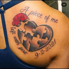 a woman with a tattoo on her stomach has a heart shaped puzzle piece in it