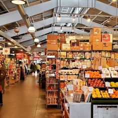 the inside of a grocery store filled with lots of produce