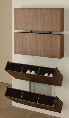 two wooden shelves with compartments on the wall