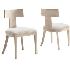 two white chairs sitting next to each other