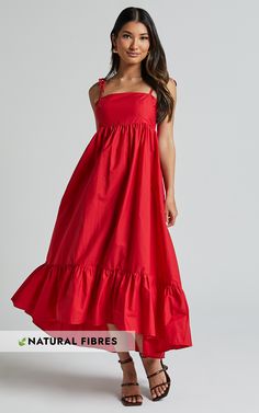 Get ready to turn heads in the stunning Aveiro Midi Dress. This vibrant red dress is perfect for any party or day event, with its flattering A-line silhouette and straight neckline. The shoulder ties add a touch of playful charm, while the high-low ruffle hem adds a feminine and flirty flair. Made from lightweight poplin cotton, this sleeveless midi dress is not only stylish but also comfortable to wear all day long. Whether you're dancing the night away or enjoying a sunny brunch with friends, Dress Red Long, Flowy Summer Dress, Dresses For The Races, Flowy Summer Dresses, Red Summer Dresses, Tiered Midi Dress, Straight Neckline, Dress Silhouette, Midi Dress Sleeveless