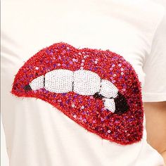 This Sparkle Lips Tee Is Perfect To Add A Fun Piece To Your Wardrobe. White Short Sleeve Trendy Red T-shirt For Party, White Cotton Party T-shirt, Red Sequin Tops For Spring, Red Short Sleeve T-shirt For Party, Casual White Sequined Tops, Casual Red Sequined Tops, Red Casual T-shirt For Party, Casual Red T-shirt For Party, Red Casual Party T-shirt