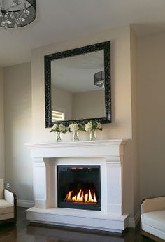 a living room with a fire place and couches