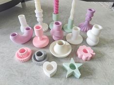 there are many different shapes and sizes of vases on the table with each other