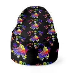 a black beanie hat with colorful stars and rainbows on the front, featuring an image of a rock star