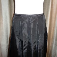 "Striking and stunning long length Black Taffeta Silk Like Skirt which can be dressed up or dressed down and has a classic timeless appeal to it. This is made with 100% Acetate Fabric and is Dry Clean Only. Measurements of this Mint Condition, Never Worn, Long Length Pleated Skirt are as follows: Length: 42\" long Waist: 14.5\" wide, or 28\" all around Hips: 32\" wide or 64\" all around Easy to ship, this will be insured for the price paid against loss and/or damage during transit. Thank you for Fitted A-line Maxi Skirt With Gathered Detail, Long Pleated Silk Skirt, Formal Long Lined Skirt, Formal Full Skirt In Solid Color, Formal Solid Color Full Skirt, Silk Skirt With Accordion Pleats, Silk Skirt With Accordion Pleats In Full Shape, Black Fitted Full Length Pleated Skirt, Elegant Fitted Satin Pleated Skirt