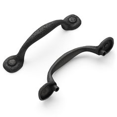 two black iron handles on a white background