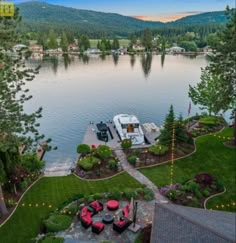 an aerial view of a boat dock in the middle of a lake